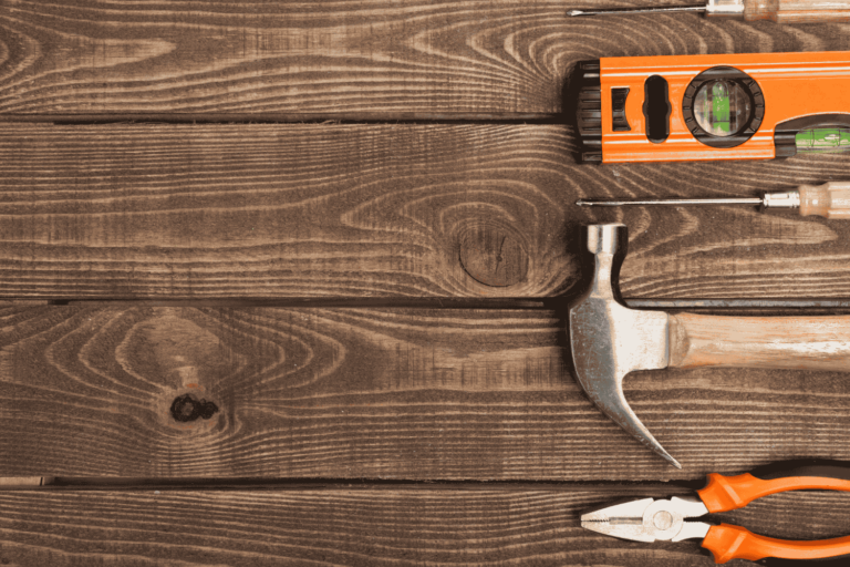 A wooden surface being filled with wood filler.