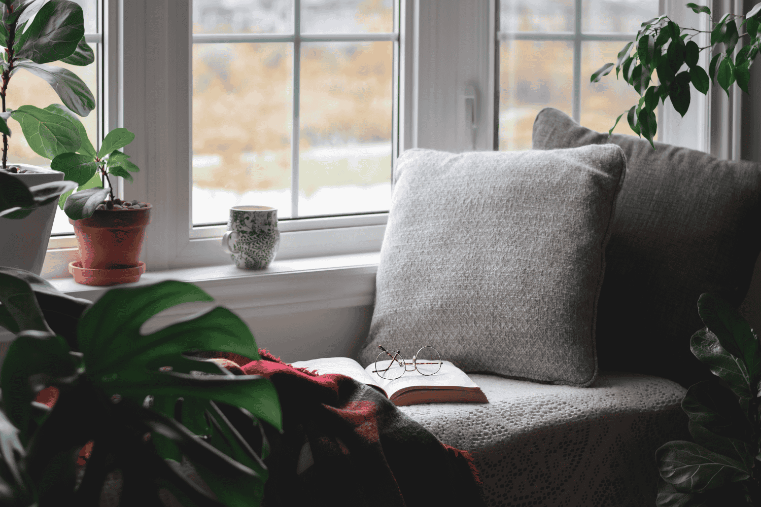 A bay window providing additional seating in a bright dining area.