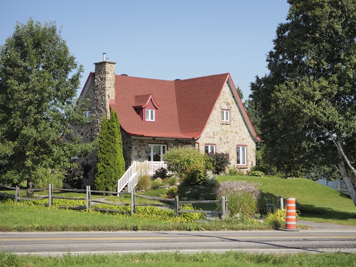 Stone cottage home with a red roof
